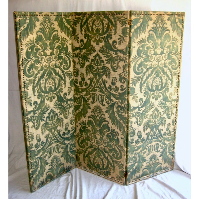 Three parts paravent screen covered with a very rare old Fortuny that is not in production or was not mass produce as this...