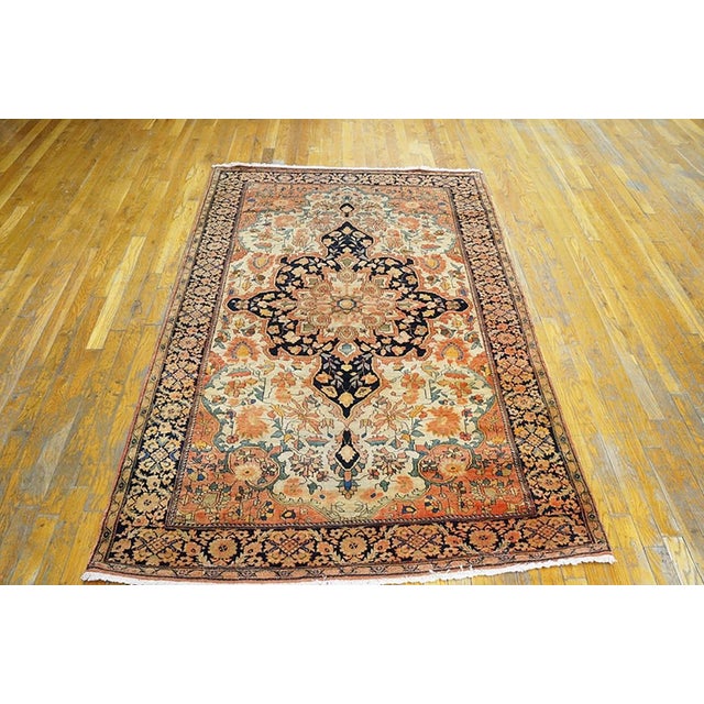Antique Persian Sarouk rug, size: 4'4" x 6'6". Antique Sarouk - Farahan Persian Ivory 1900s Rug, Circa Date: 1900s. This...