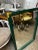 Vintage Mid-Century 1960s English green with brass accent corners Campaign style wall mirror.