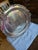 Add a touch of classic elegance to your home with this beautiful vintage round silver-plated serving tray made by Oneida...