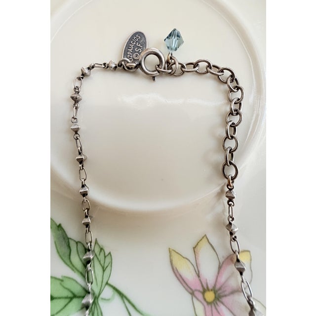 Arts & Crafts Vintage Sterling Silver Necklace by Designer Liz Palacios Sf, Featuring a Mother of Pearl Pendant With a Central Crystal, and Dangling Charm Accent For Sale - Image 3 of 5