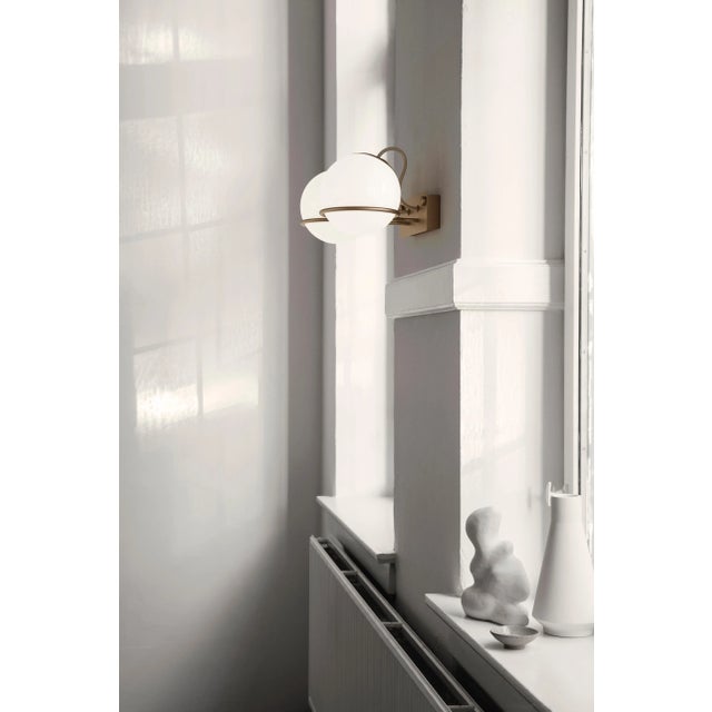 Gino Sarfatti Model 238/2 wall lamp in champagne. Designed in 1959, this is an authorized 2018 Astep/Flos re-edition by...