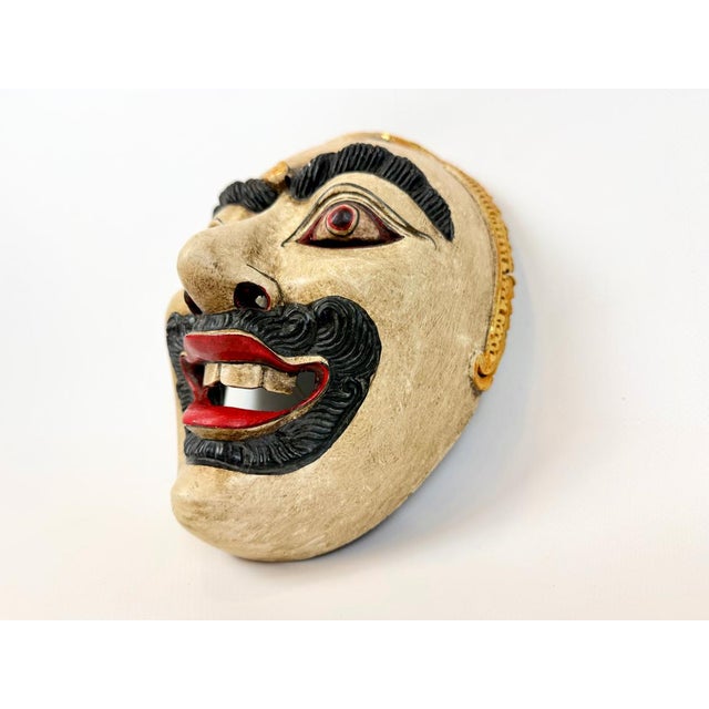 An exceptional and rare 19th- to early 20th-century antique Javanese Topeng wooden mask originating from Yogyakarta,...