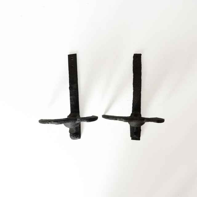 Pair of cast iron snow eagles designed to keep snow from falling off of buildings. Could still be used for this purpose if...