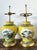 This striking pair of vintage Chinoiserie table lamps captures the vibrant elegance of traditional Asian artistry....