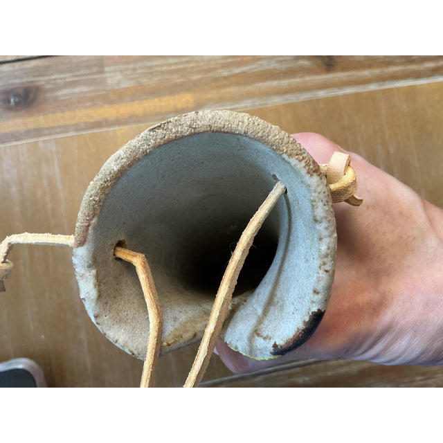 Bring an organic, artisan touch to your gallery wall with this unique hand-built studio pottery wall pocket vase. Crafted...