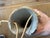 Bring an organic, artisan touch to your gallery wall with this unique hand-built studio pottery wall pocket vase. Crafted...