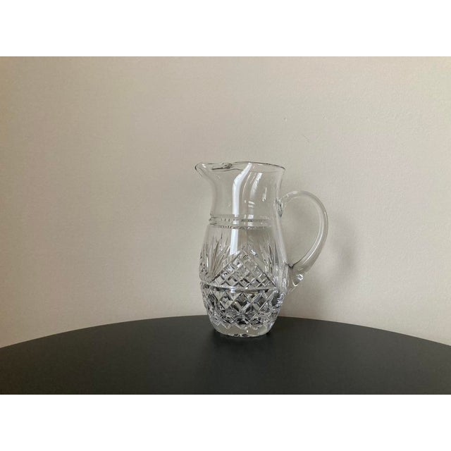 Beautiful heavy crystal etched glass water or lemonade pitcher from Ireland, circa early 20th century. Delicate etched...