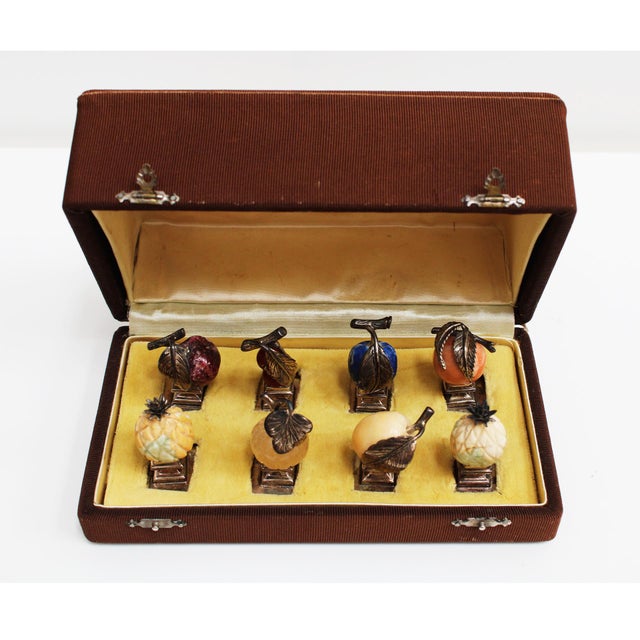 A rare vintage Gucci set of eight hardstone fruit place card holders, handcrafted in Italy circa 1960 and presented in its...
