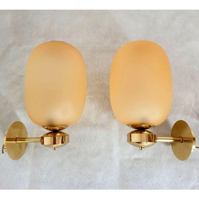Pair of Mid-Century-Modern Murano glass and brass sconces, Barovier & Toso style Italy 1990s. Three pairs available. Set...