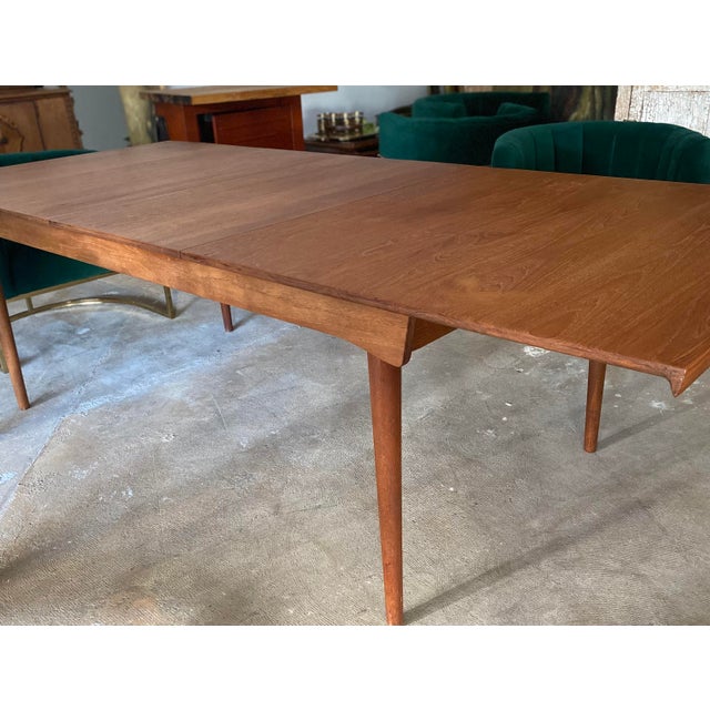 Finn Juhl for France & Son Dining Table and one extension sleeve. Marked with Metal Emblem Tag at underside of table top...