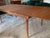 Finn Juhl for France & Sons Dining Table and one extension sleeve. Marked with Metal Emblem Tag at underside of table top...