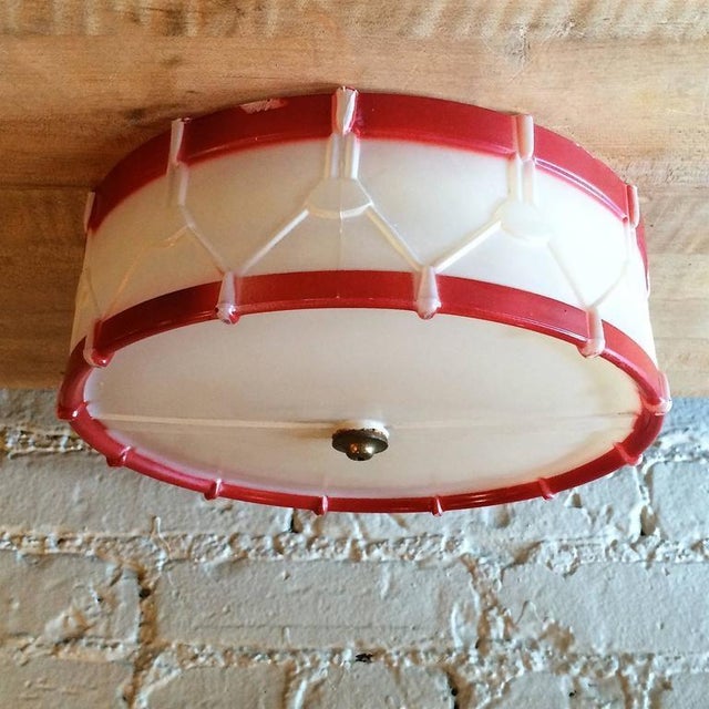 This is a whimsical, art deco, flush mount, ceiling light cover shade in the manner of a toy snare drum. The molded glass...