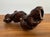 Corkscrew wine bottle opener made from the wood fragment of a vineyard vine and finished with a high gloss varnish. A...