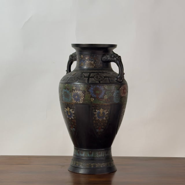 Large imported Japanese bronze vase with floral cloisonné details. An elegant piece of traditional Japanese decorative art...