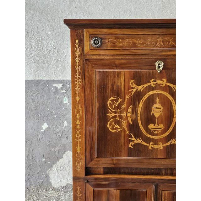 Elegant Louis XVI-style secretary desk dating back to the mid-20th century. The piece is beautifully crafted from cherry...