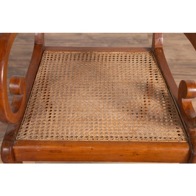 Antique Javanese Wooden Armchair with Carved Back, Curving Arms and Rattan Seat For Sale - Image 12 of 13