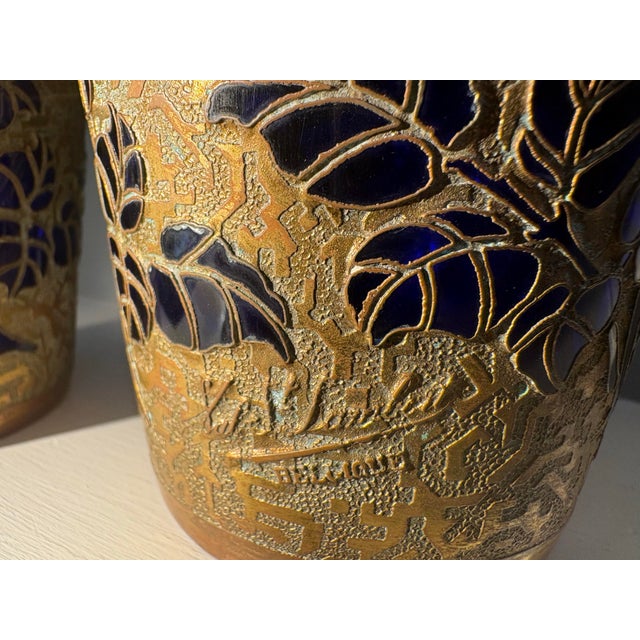 Matching pair of Val Saint-Lambert vases. Cobalt crystal with gilt galvanoplasty metal overlay with a floral design. Circa...