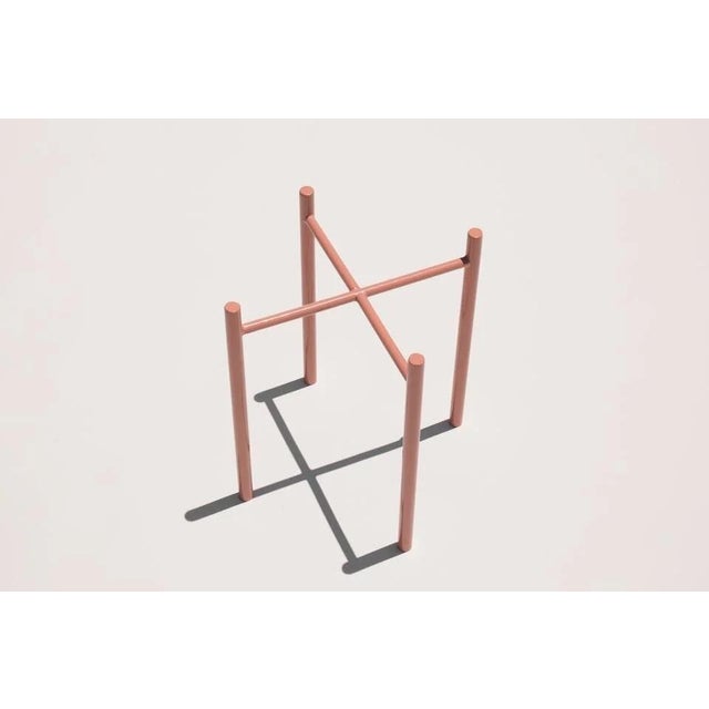 Minimalist planter stand from Yield Design. Powder coated steel. Four legs. Suitable for indoor and outdoor use. Designed...