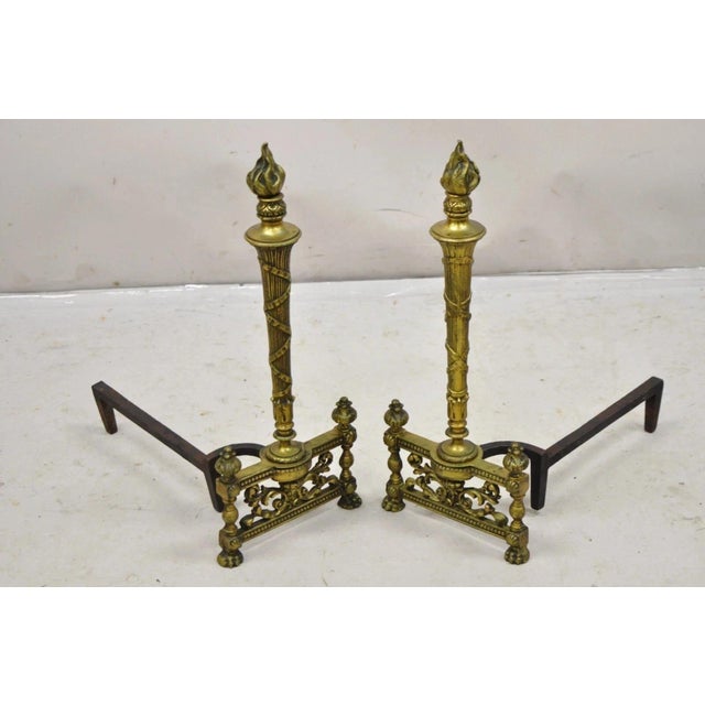 Antique French Empire Style Flame Finial Brass and Cast Iron Andirons - a Pair. Circa Early 20th Century. Measurements:...