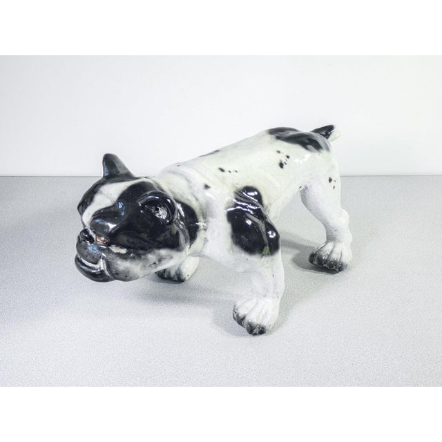 French Bulldog sculpture in a heair terracotta. Origin France First twentieth century branded the brands on the legs are...
