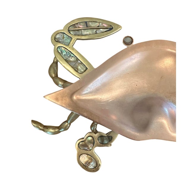 A quirky, mid century catchall dish. Features a mixed metal design in brass and copper featuring a crab. Inlaid with...