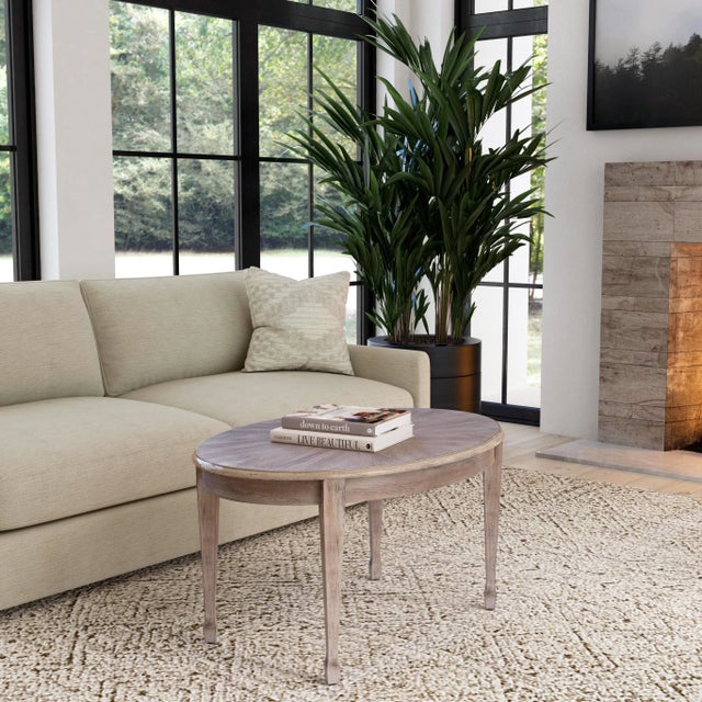 Timeless in its allure, this elegant coffee table features a veneer top and exquisitely tapered legs. Meticulously crafted...