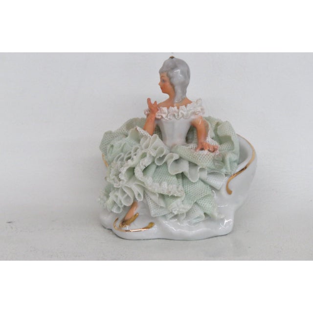This darling Miniature Figurine is made out of porcelain. This lovely piece was made by Sandizell in Germany, and is...