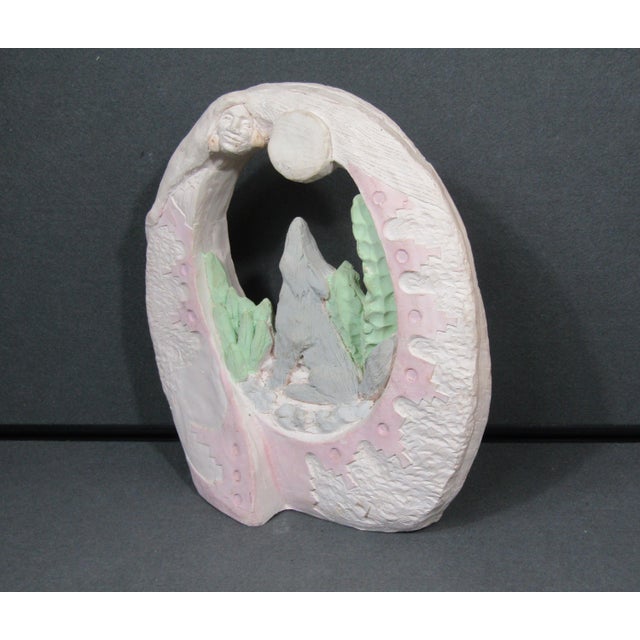 A serene Southwestern scene: a lone wolf howls to a full moon, framed by Pueblo-style textures and soft desert pastels....