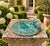 A classic vintage iron verdigris garden sundial inspired by traditional English estate landscapes, featuring a charming...
