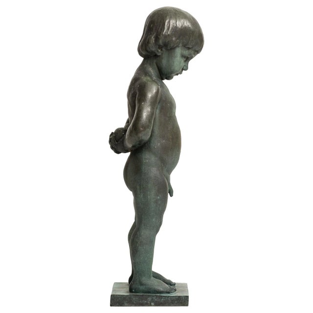 Sculpture ‘Boy with apple’ by Anders Jönsson. Founded mark Erik Pettersson fud. In Sweden.