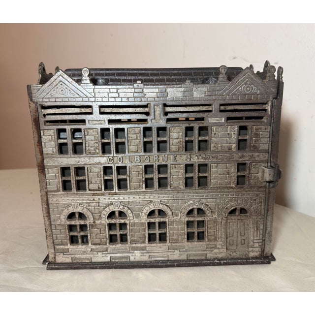 Up for sale is an exceedingly rare complete large antique 1891 Traders Bank Toronto cast iron still bank. This 4 slot...