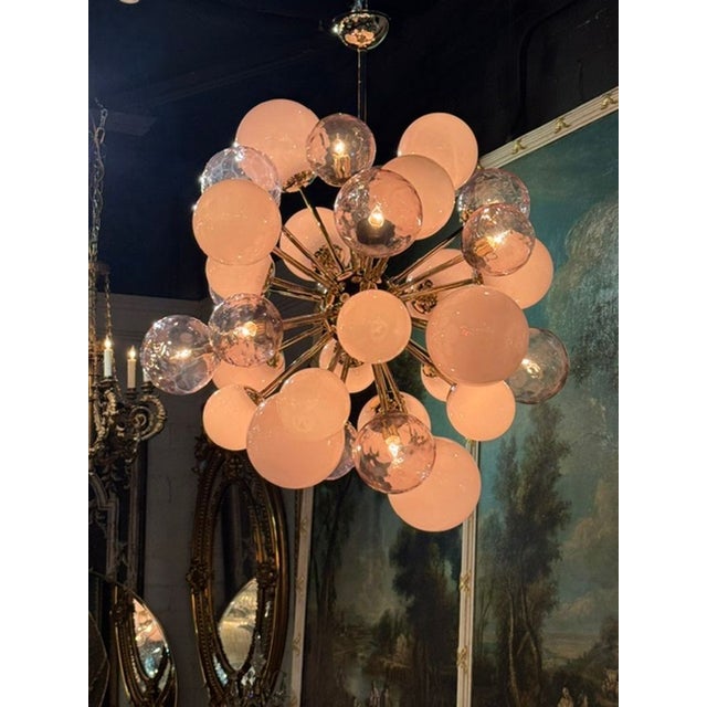 The Murano Glass Pink Cloud Chandelier is a stunning lighting fixture that adds a touch of elegance to any room. Made with...
