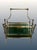 An elegant magazine & newspaper rack, made in France circa the 1950-60's from brass and smokey gray glass. Brass...