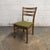 A set of four vintage Danish teak dining chairs by Farstrup, Model 219. The chairs have tall curved backs with horizontal...