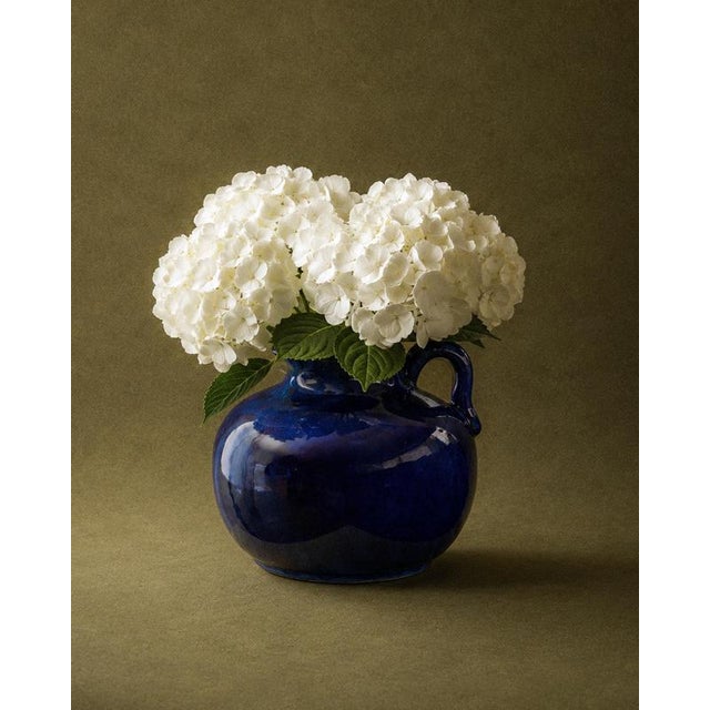 This vintage ceramic jug vase from the 1960s is a striking example of sculptural Mid Century design. Its generously...