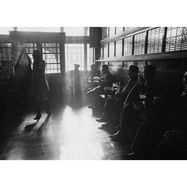 The Blind Beggar Customers relaxing at the Blind Beggar, famous pub where gangster Ronnie Kray shot and killed a rival,...