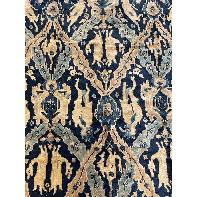 This remarkable antique Chinese rug from the early 20th century, circa 1900s, measures approximately 11'8" x 9'2" and...