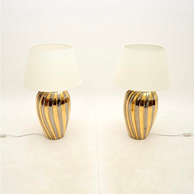 A large and stunning pair of vintage Italian ceramic table lamps. They were made in Italy, and date from around the...