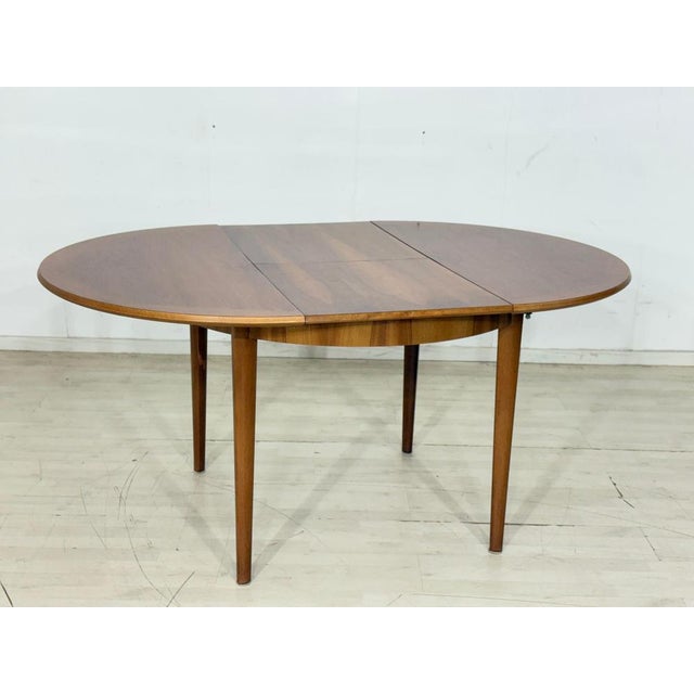 For sale is this beautiful vintage dining table, distinguished by its round shape and particularly warm wood grain. It can...
