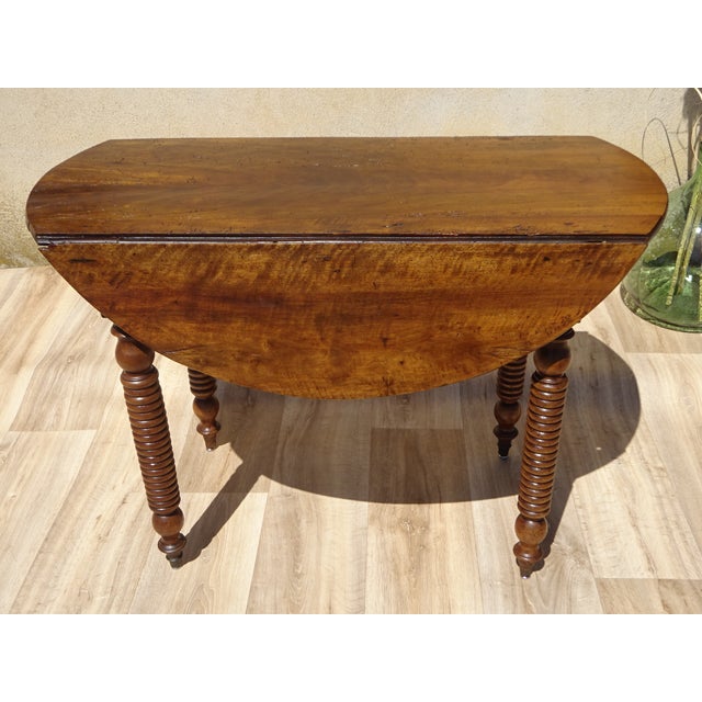Small dining table for 2 to 4 people or console table. Almost round 90x98cm solid walnut top, 2cm thick. Leaf drops on...