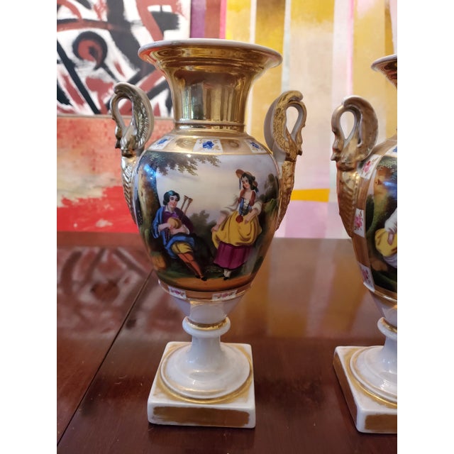 A fine pair of French Paris porcelain hand painted vases with applied decorated swan side adornments. Absolutely over 150...