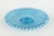 Decorative pressed-glass dish in light blue with a ruffled edge and an embossed floral and vine pattern. A characteristic...