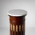 Fluted column in mahogany veneer, with a white marble top and fire-gilt appliqués in the fluting. The chest of drawers...