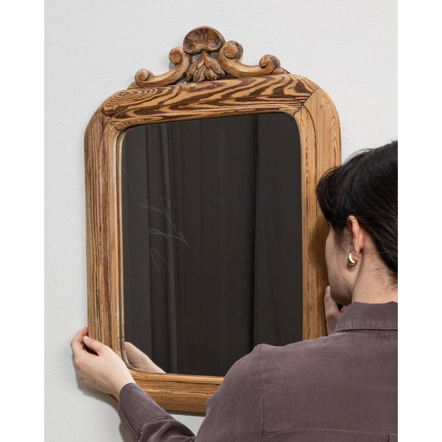 This mirror makes its impression through natural honey oak frame with carved crest, arched. The piece dates to 1900s,...