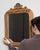 This mirror makes its impression through natural honey oak frame with carved crest, arched. The piece dates to 1900s,...