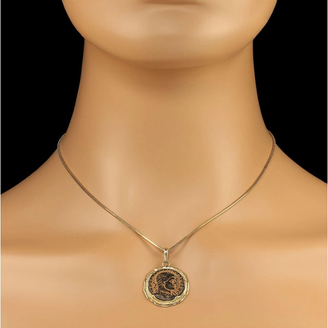 This is part of Chairish’s Fine Jewelry assortment. Antique Coin Replica Pendant in Rich 14K Yellow Gold Bezel – Featuring...
