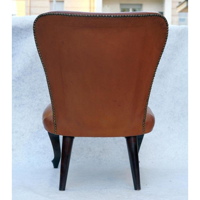 Leather chair, Made in Italy, 1940s. Detail Chair with shaped back and seat in Original leather that rests on carved front...