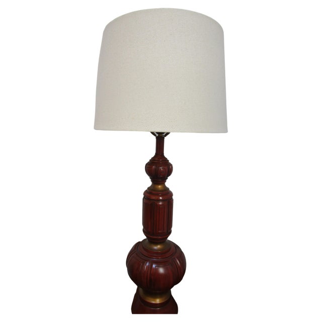Shape and color cause this lamp by F.A.I.P. to stand out from the crowd. It has a beautiful rust-orange color and...