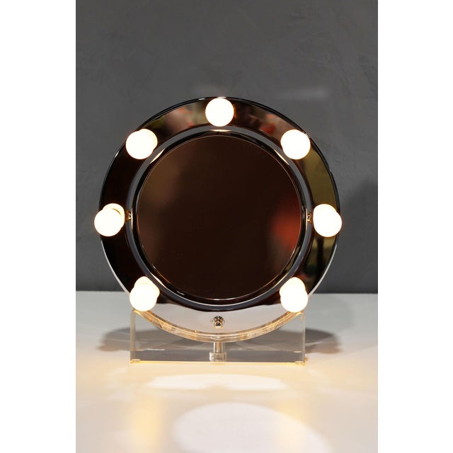 Elevate your vanity with the stunning and rare makeup mirror designed and manufactured by Charles Hollis Jones in the...